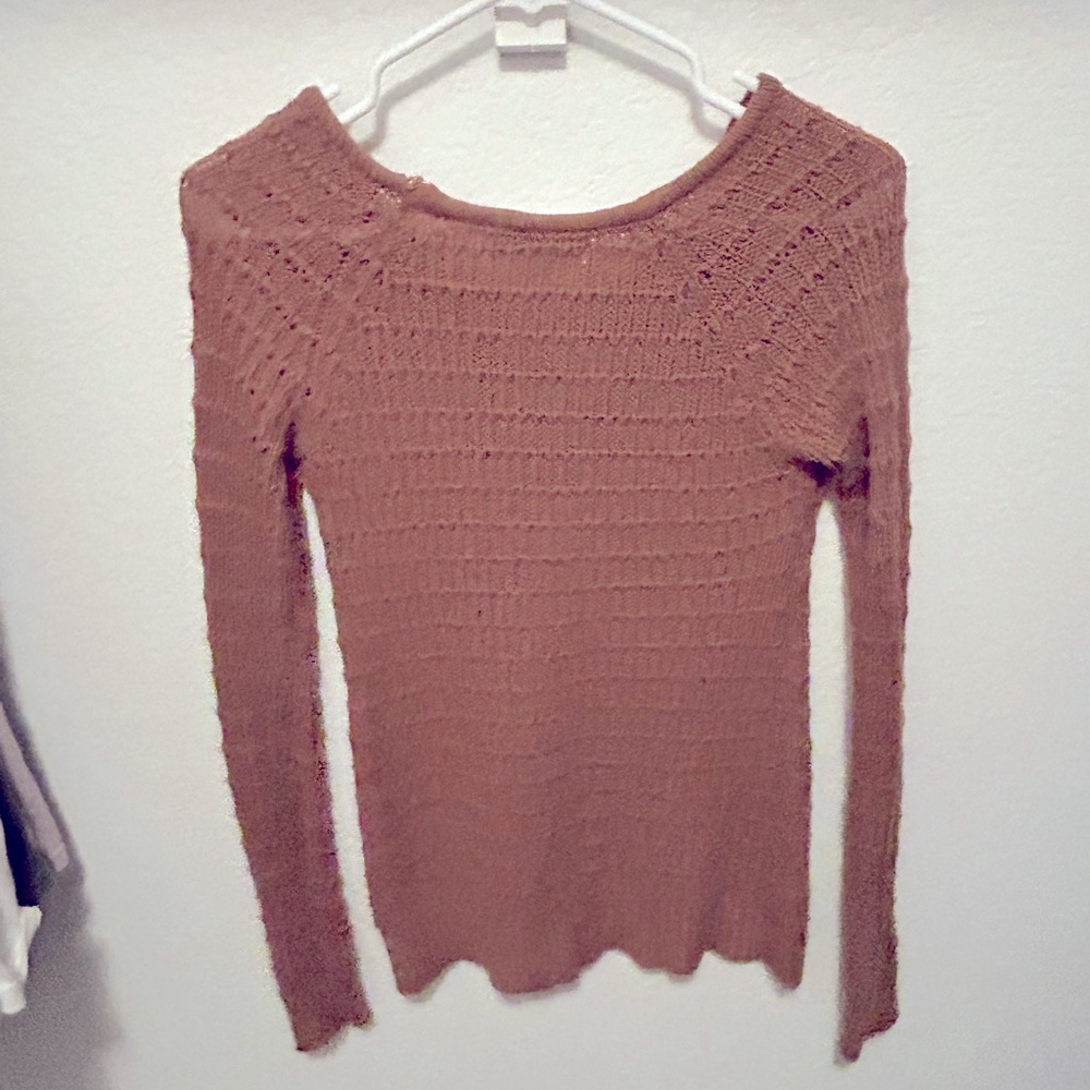 Woman’s light sweater woven material.
